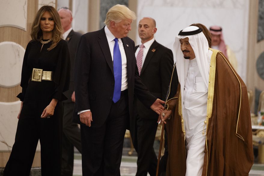 President Donald Trump and first lady Melania Trump walk with Saudi King Salman to a coffee ceremony and presentation ceremony of The Collar of Abdulaziz Al Saud Medal at the Royal Court Palace, Saturday, May 20, 2017, in Riyadh. (AP Photo/Evan Vucci)