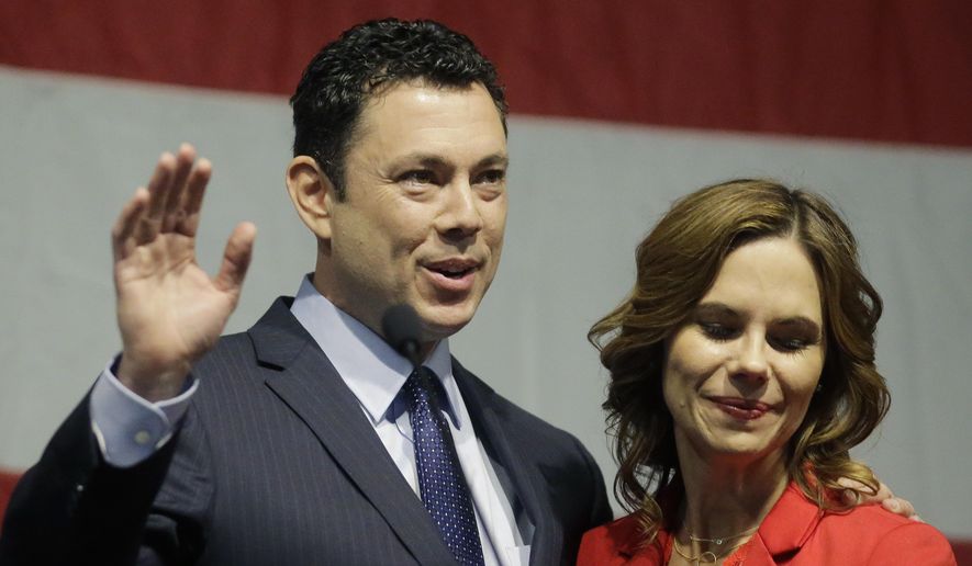 U.S. Rep. Jason Chaffetz waves to the Utah GOP Convention while his wife Julie looks on Saturday, May 20, 2017, in Sandy, Utah. Chaffetz said this week that he's stepping aside from Congress next month during the prime of his career and just as his committee was poised to investigate President Donald Trump's firing of FBI Director James Comey.  (AP Photo/Rick Bowmer)