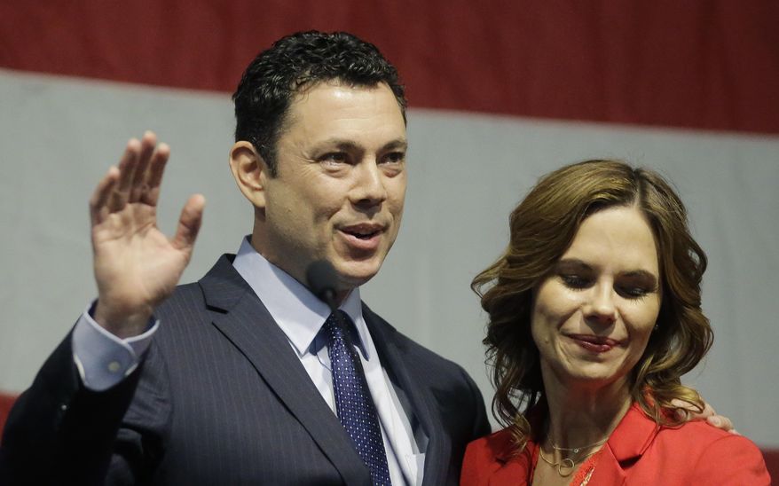 U.S. Rep. Jason Chaffetz waves to the Utah GOP Convention while his wife Julie looks on Saturday, May 20, 2017, in Sandy, Utah. Chaffetz said this week that he's stepping aside from Congress next month during the prime of his career and just as his committee was poised to investigate President Donald Trump's firing of FBI Director James Comey.  (AP Photo/Rick Bowmer)