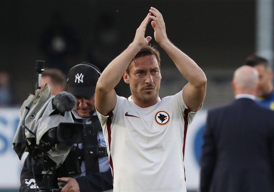 Roma's Francesco Totti waves to supporters at the end of the Italian Serie A soccer match between Chievo and Roma at the Bentegodi stadium in Verona, Italy, Saturday, May 20, 2017. (Simone Venezia/ANSA via AP)