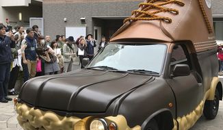 In this April 26, 2017 photo provided by L.L. Bean, the company&#39;s Bootmobile is displayed in Tokyo, Japan. The Maine-based outdoors company already has two of the rolling Bean boots in the U.S. Now this third version will be visiting Bean&#39;s stores in Japan. (Hideki Hashiramoto/L.L.Bean via AP)