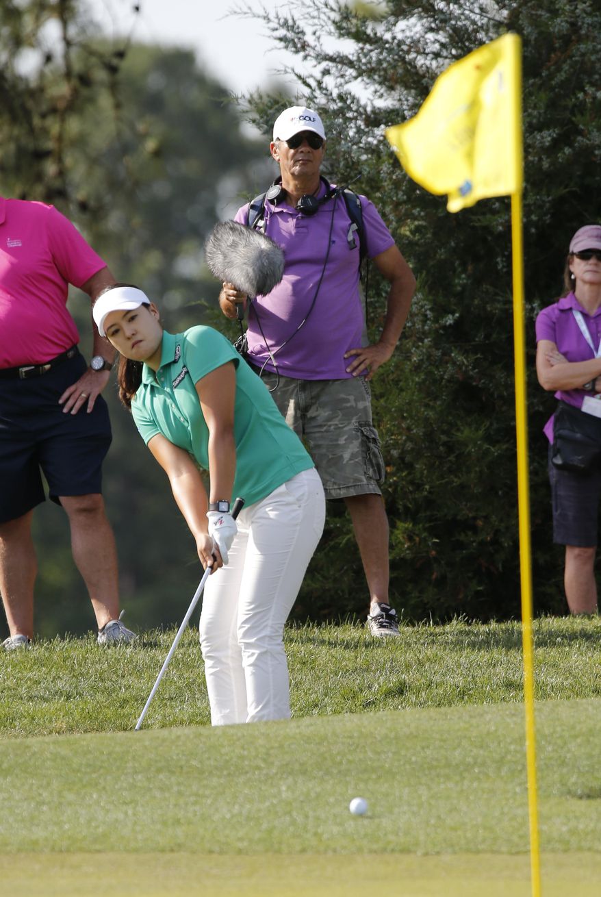 In Gee Chun, of Korea, chips up to the tenth green during the third round of the Kingsmill Championship LPGA golf tournament in Williamsburg, Va., Saturday, May 20, 2017. (AP Photo/Steve Helber)