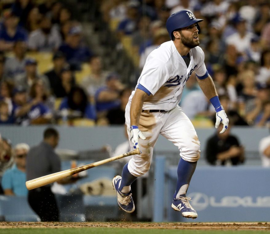 Los Angeles Dodgers' Chris Taylor watches his home run against the Miami Marlins during third inning of a baseball game in Los Angeles, Friday, May 19, 2017. (AP Photo/Chris Carlson)