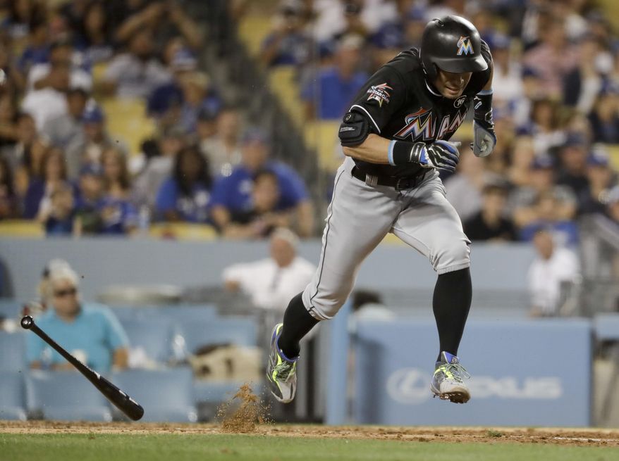 Miami Marlins' Ichiro Suzuki runs to first on a ground-out against the Los Angeles Dodgers during the fifth inning of a baseball game in Los Angeles, Friday, May 19, 2017. (AP Photo/Chris Carlson)