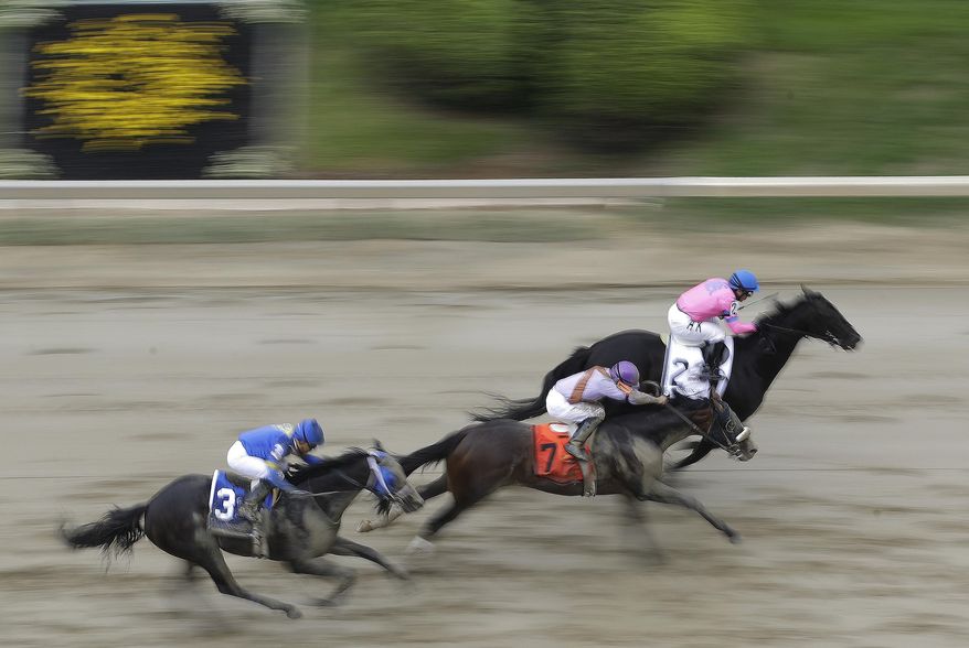 Super Dude with Horacio Karamanos aboard leads the way in the fourth race ahead of the running of the Preakness Stakes horse race at Pimlico race course, Saturday, May 20, 2017, in Baltimore. The 142nd Preakness Stakes horse race runs Saturday. (AP Photo/Patrick Semansky)