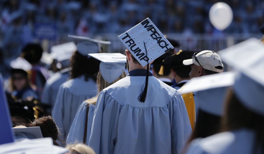 A student wears a hat reading &quot;Impeach Trump&quot; during a graduation ceremony at Columbia University in New York, Wednesday, May 17, 2017. (AP Photo/Seth Wenig)