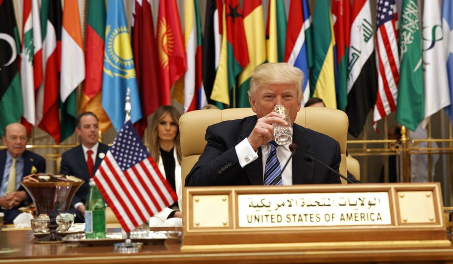 President Donald Trump takes a drink of water before delivering a speech to the Arab Islamic American Summit, at the King Abdulaziz Conference Center, Sunday, May 21, 2017, in Riyadh, Saudi Arabia. (AP Photo/Evan Vucci)