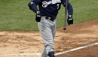 Milwaukee Brewers&#39; Eric Thames (7) throws his bast after striking out against the Chicago Cubs during the fourth inning of a baseball game, Friday, May, 19, 2017, in Chicago. (AP Photo/David Banks)