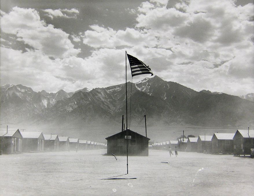 In this 1942 photo taken by Dorothea Lange and provided by the Collection of the Oakland Museum of California, gift of Paul S. Taylor, is Manzanar Relocation Center, Manzanar, California. The photo is part of a new exhibit at the Oakland Museum of California called, Dorothea Lange: Politics of Seeing. The exhibit, which runs through August 13th, includes 100 of Lange's photographs including recognized works and new improved unframed prints that have been digitally scanned. (Dorothea Lange/Collection of the Oakland Museum of California, gift of Paul S. Taylor via AP)