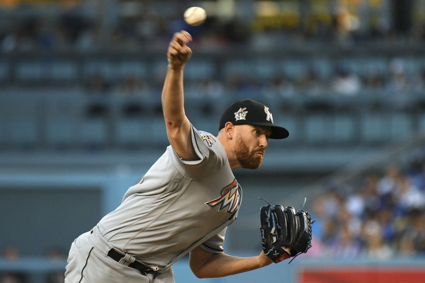 Miami Marlins' Dan Straily delivers a pitch against the Los Angeles Dodgers during the first inning of a baseball game in Los Angeles, Saturday, May 20, 2017. (AP Photo/Michael Owen Baker)
