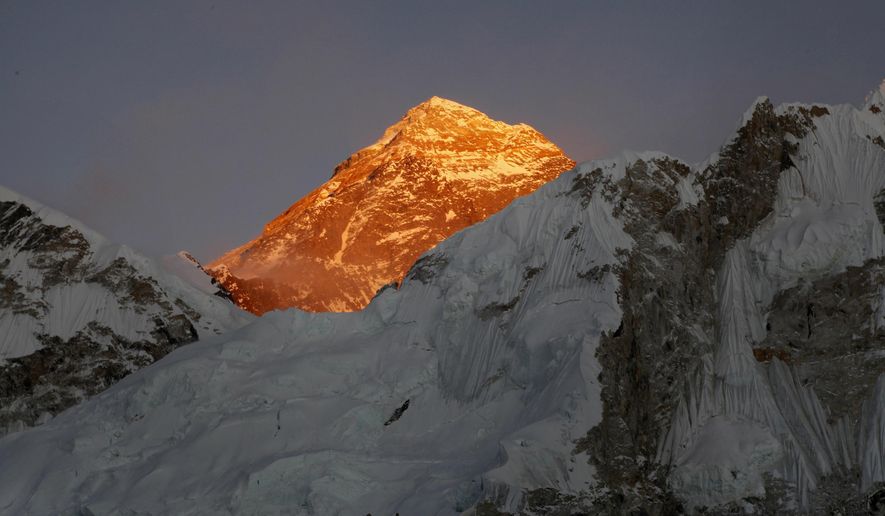 FILE - In this Nov. 12, 2015, file photo, Mt. Everest is seen from the way to Kalapatthar in Nepal. An American climber has died near the summit of Mount Everest and an Indian climber is missing after heading down from the mountain following a successful ascent, expedition organizers said Sunday. (AP Photo/Tashi Sherpa, File)