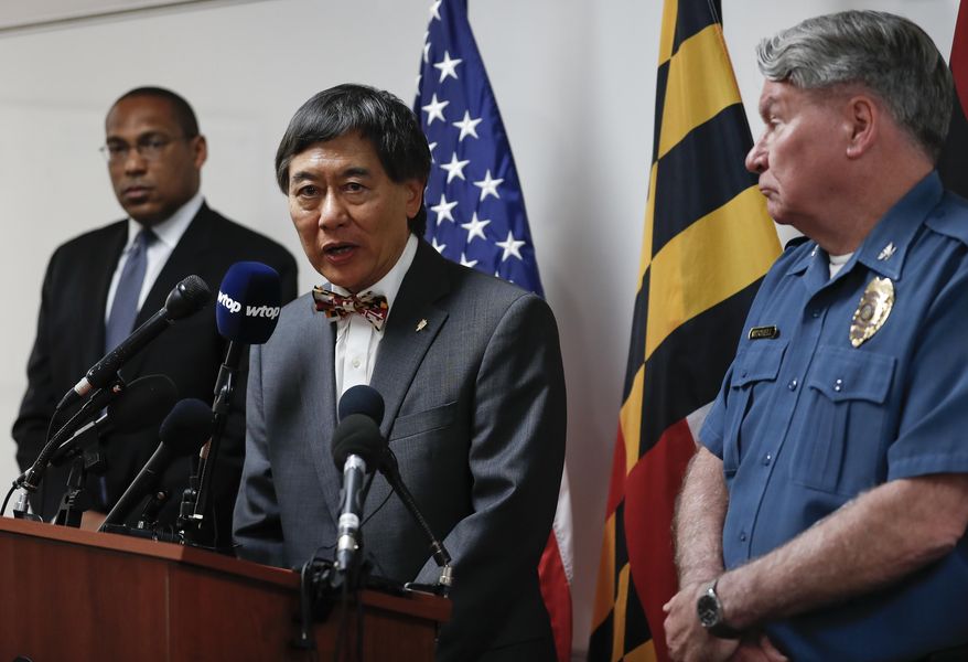 University of Maryland President Wallace Loh, center, with University of Maryland Police Chief David Mitchell, right, and Gordon Johnson, FBI special agent in charge of the Baltimore Field Office, left, speaks during a news conference at the University of Maryland Police Department Headquarters in College Park, Md, Sunday, May 21, 2017, about the stabbing death of a visiting student at the University of Maryland. A University of Maryland student was charged Sunday with fatally stabbing a visiting student on campus in what police have described as an unprovoked attack that rattled the school over graduation weekend. (AP Photo/Carolyn Kaster)