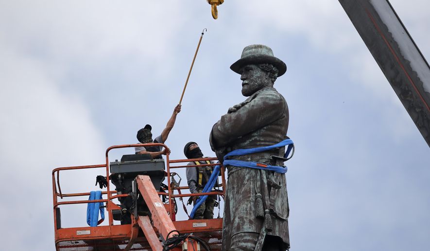 FILE- In this Friday, May 19, 2017, file photo, workers prepare to take down the statue of former Confederate general Robert E. Lee, which stands over 100 feet tall, in Lee Circle in New Orleans. Mississippi Rep. Karl Oliver of Winona apologized on Monday, May 22, for saying Louisiana leaders should be lynched for removing Confederate monuments, only after his comment sparked broad condemnation in both states. The post was made after three Confederate monuments and a monument to white supremacy were removed in New Orleans. (AP Photo/Gerald Herbert, File)