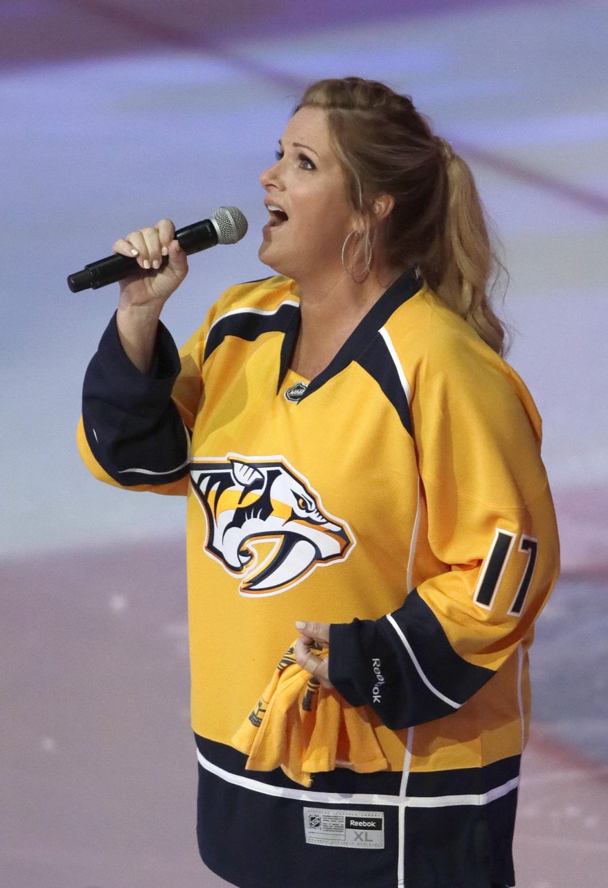 Trisha Yearwood performs the National Anthem before Game 6 of the Western Conference final in the NHL hockey Stanley Cup playoffs Monday, May 22, 2017, in Nashville, Tenn. (AP Photo/Mark Humphrey)