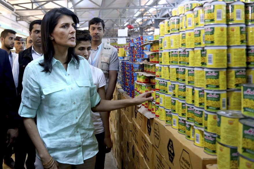 U.S. Ambassador to the United Nations Nikki Haley tours a supermarket run by the Norwegian Refugee Council and partly funded by the U.S. during a visit to the Zaatari Refugee Camp, Jordan, Sunday, May 21, 2017. (AP Photo/Raad Adayleh, Pool)