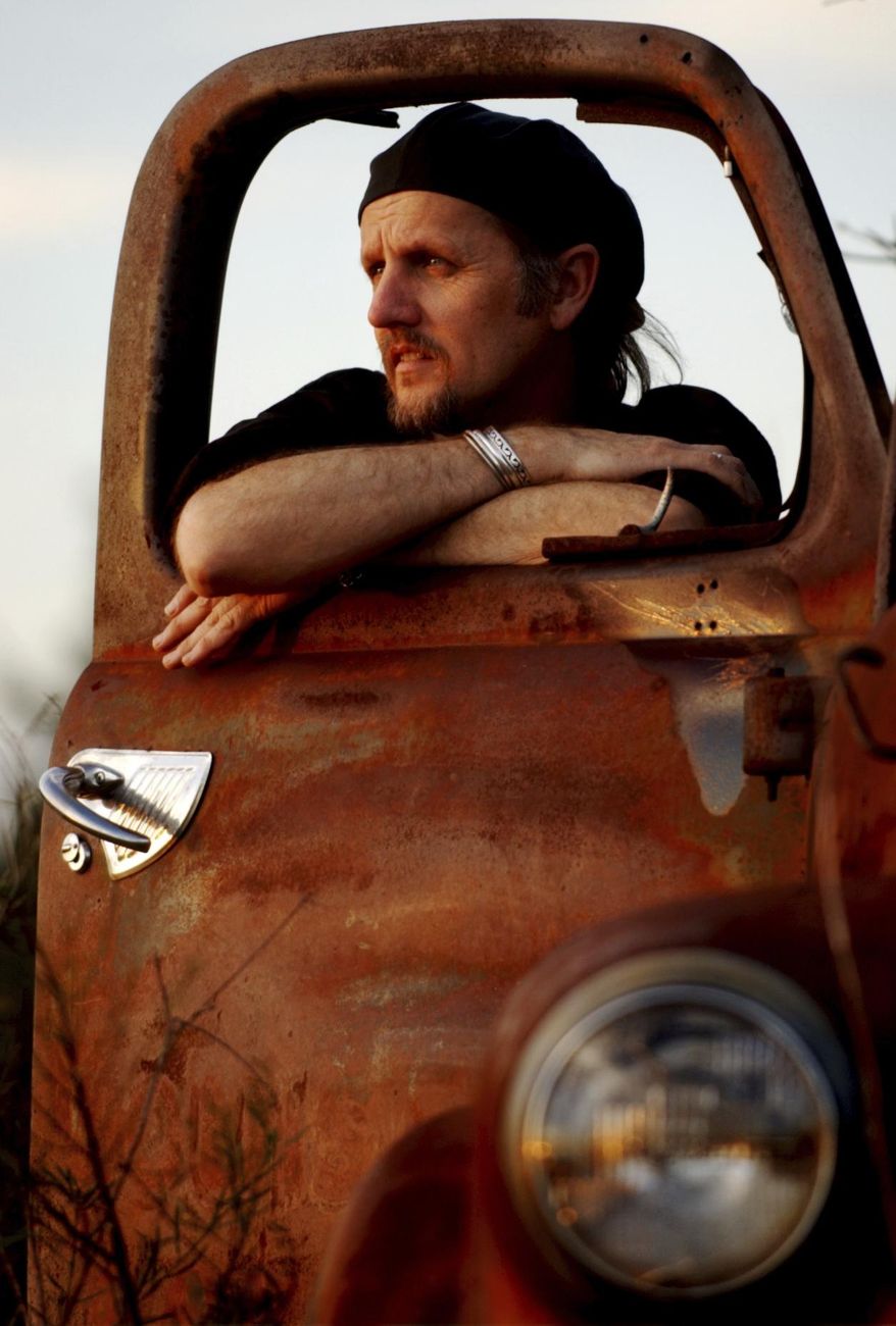 In this Feb. 15, 2005, photo, singer-songwriter Jimmy LaFave poses for a portrait in Austin, Texas. A statement on Monday, May 22, 2017, from Music Road Records says LaFave died Sunday at his Austin home after a fight with cancer. He was 61. (Matt Rourke/Austin American-Statesman via AP)