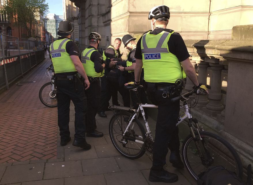 Police detained a man Tuesday near a vigil for victims of the Manchester Arena bombings, but fans at the Ariana Grande concert said there was virtually no physical inspection of bags and knapsacks at the gates. (Associated Press)