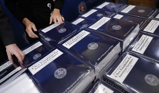 Senate Budget Committee staff members lay out copies of President Donald Trump&#39;s fiscal 2018 federal budget for distribution on Capitol Hill in Washington, Tuesday, May 23, 2017. (AP Photo/Pablo Martinez Monsivais)