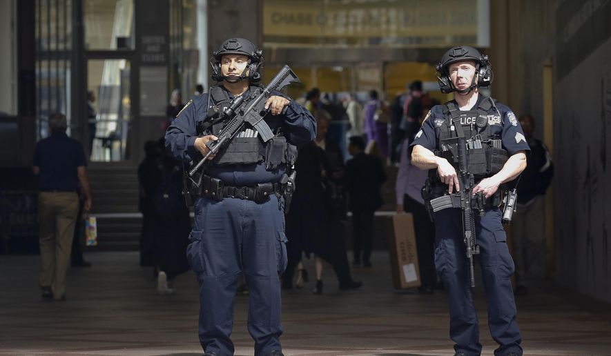 A New York Police Department anti-terror unit guard an entry area to Madison Square Garden, Tuesday May 23, 2017, in New York. The NYPD says it has tightened security at high-profile locations "out of an abundance of caution" following the deadly explosion in Manchester, England.(AP Photo/Bebeto Matthews)