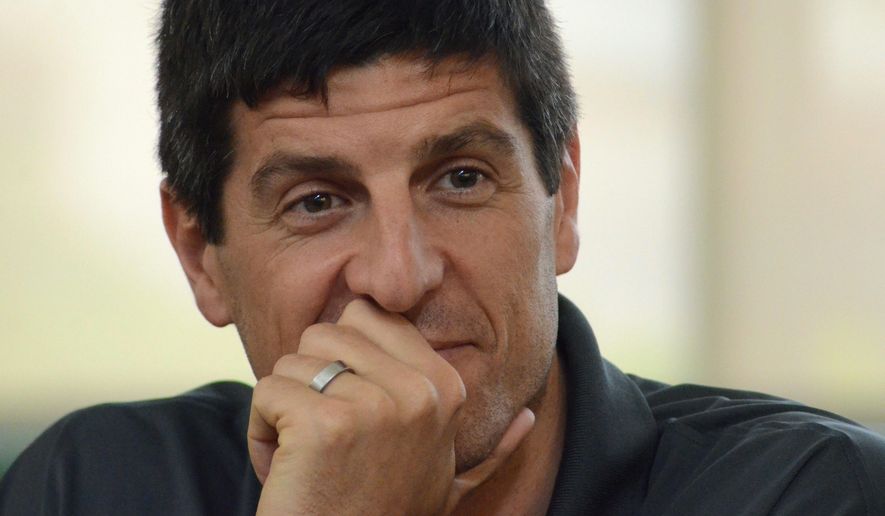 Sebastien Bellin, a former basketball player who was badly wounded in the suicide bomb attack on Brussels airport in 2016, considers a question while visiting Charlotte Middle School in Charlotte, Mich., on Tuesday, May 23, 2017. Bellin, who played for Oakland University in suburban Detroit as well as the Belgian team, discussed his personal experiences in the wake of the attack. (Trace Christenson /Battle Creek Enquirer via AP)