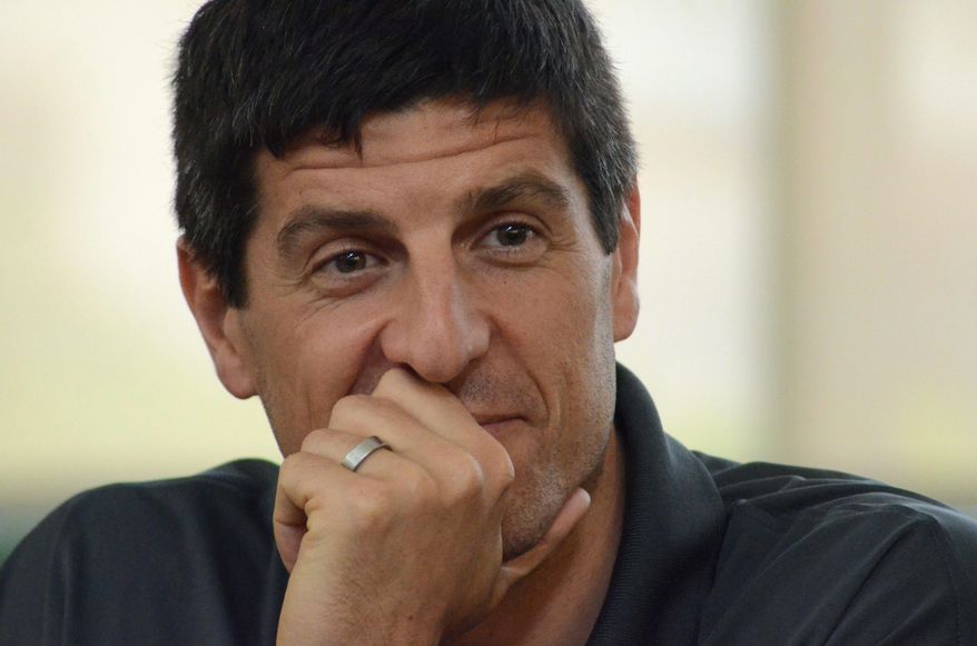 Sebastien Bellin, a former basketball player who was badly wounded in the suicide bomb attack on Brussels airport in 2016, considers a question while visiting Charlotte Middle School in Charlotte, Mich., on Tuesday, May 23, 2017. Bellin, who played for Oakland University in suburban Detroit as well as the Belgian team, discussed his personal experiences in the wake of the attack. (Trace Christenson /Battle Creek Enquirer via AP)