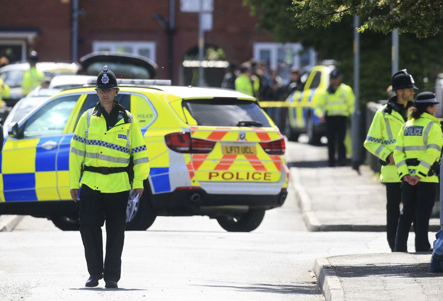 Police attend the scene following an arrest in Chorlton, south Manchester, England, Tuesday May 23, 2017. Greater Manchester Police say they have arrested a 23-year-old man in connection with the apparent suicide bombing at an Ariana Grande concert in the city on Monday night. (Danny Lawson/PA via AP)