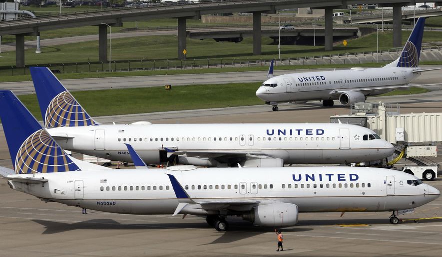 FILE - In this July 8, 2015, file photo, United Airlines planes are seen on the tarmac at the George Bush Intercontinental Airport in Houston. United Airlines says a disruptive passenger on a flight from Shanghai to New Jersey was asked to get off, resulting in an unscheduled stop in San Francisco and an arrival delayed by eight hours. Videos on social media showed an unidentified elderly man wearing a red “Make America Great Again” cap heatedly insisting that he was entitled to a seat and yelling at fellow passengers. (AP Photo/David J. Phillip, File)
