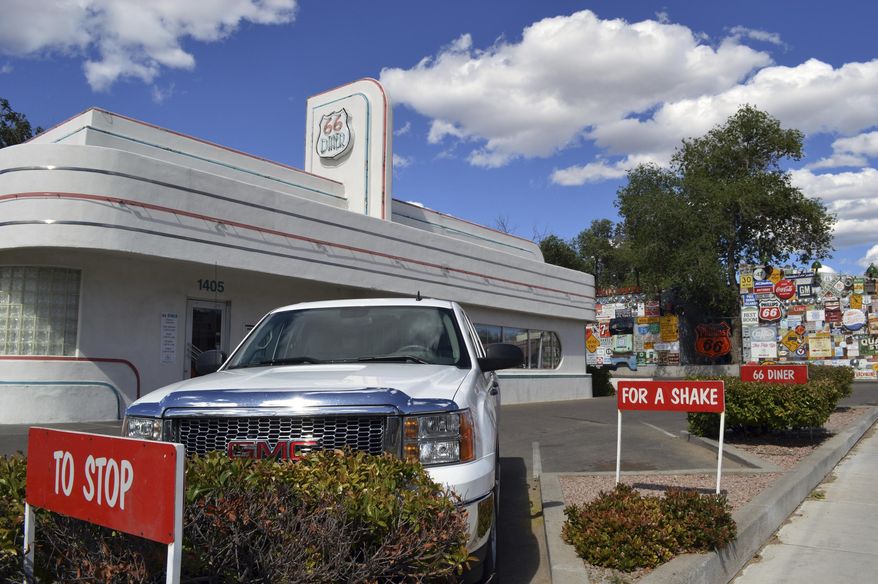 In this May 19, 2017 photo, the Route 66 Diner, once a gas station is shown in Albuquerque, N.M. Route 66, the American Mother Road that once connected motorists from Illinois to California, may lose its place in a National Park Service's preservation program, ending years of efforts aimed at reviving old tourist spots in struggling towns. A federal law authorizing the Route 66 Corridor Preservation Program is set to expire in two years. (AP Photo/Russell Contreras)