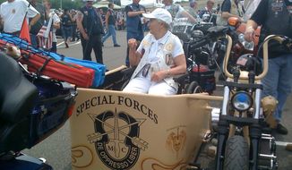 Terry Davis, past national president of American Gold Star Mothers, Inc., rode in a Rolling Thunder, Inc., demonstration in a side car with special forces emblem. Her son, Army SP4 Richard S. Davis, Jr., was killed in Vietnam in 1969. Photo courtesy of Candy Martin.