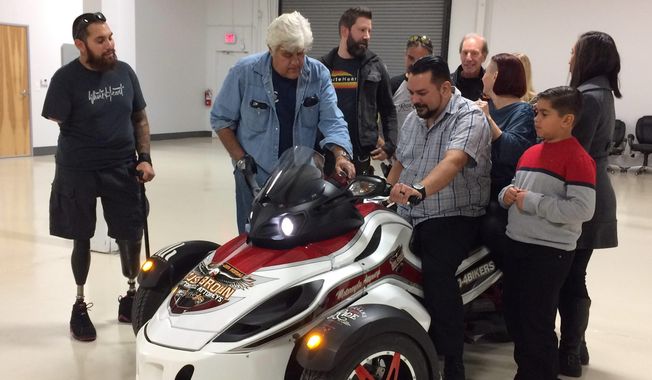 Marine Corps Sgt. Richard Silva, an amputee veteran, accepts a three-wheel Can-Am Spyder donated by Russ Brown Motorcycle Attorneys in December 2016. VeteransCharityRide.org, a nationwide program using motorcycle therapy to help wounded combat veterans adjust to civilian life, and its fiscal sponsor, White Heart Foundation, enable industry giving to deserving vets. Jay Leno helped surprise Richard with the gift.