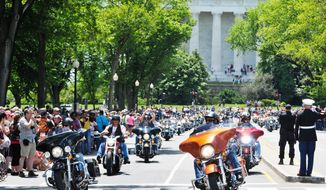 Motorcyclists from across the country shook the ground during the Rolling Thunder in the 25th anniversary of the Rolling Thunder Ride for Freedom at the base of the Memorial Bridge. Khalid Naji-Allah/ Special for the Washington Times.