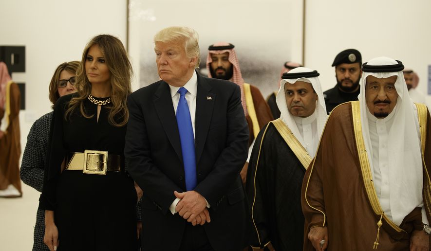 FILE - In this May 20, 2017 file photo, President Donald Trump and first lady Melania Trump visit an art exhibit with Saudi King Salam at the Royal Court Palace in Riyadh. (AP Photo/Evan Vucci, File)