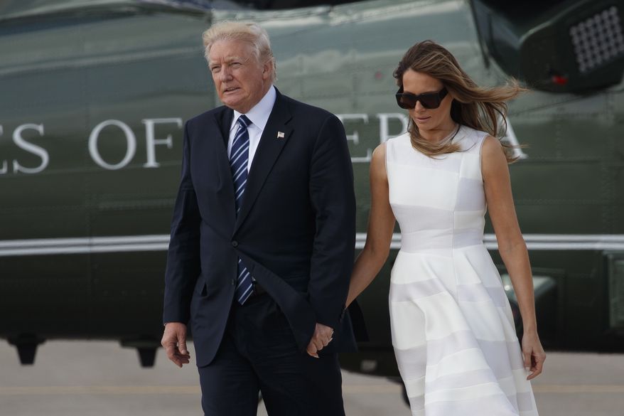 In this Tuesday, May 23, 2017, file photo, President Donald Trump and and his wife Melania hold hands as they walk from Marine One to board Air Force One, enroute to Rome, in Jerusalem. On Monday on his arrival at Ben-Gurion International Airport, President Trump turned and reached out to grab Mrs. Trump&#x27;s hand and she appeared to brush away his hand, raising speculation in local media of a possible first family fracas. It happened again in Rome on Tuesday. (AP Photo/Evan Vucci, File)