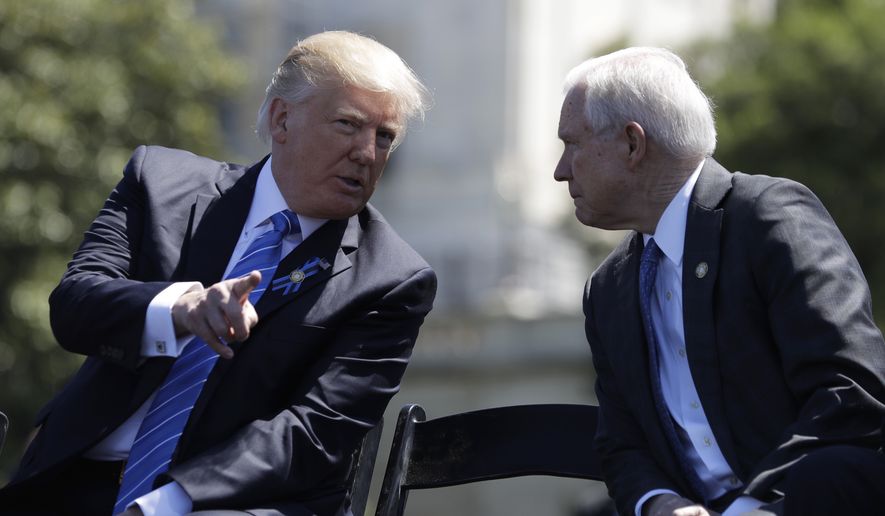 In this May 15, 2017, file photo, President Donald Trump talks with Attorney General Jeff Sessions,at the 36th Annual National Peace Officers&#39; memorial service on Capitol Hill in Washington. (AP Photo/Evan Vucci, file)