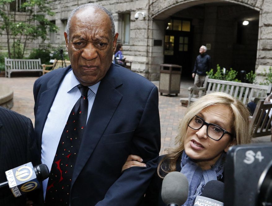 Bill Cosby, center, pauses in the courtyard as one of his attorneys Angela Agrusa, right, makes a statement to the media, as they arrive for the third day of jury selection in his sexual assault case at the Allegheny County Courthouse, Wednesday, May 24, 2017, in Pittsburgh. The case is set for trial June 5 in suburban Philadelphia. (AP Photo/Gene J. Puskar)
