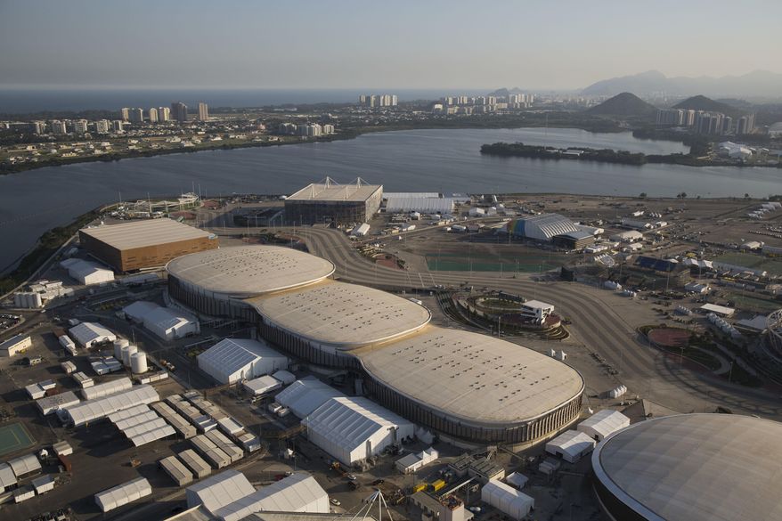 File - In this July 4, 2016 file photo, the Olympic Park of the 2016 Olympics is seen from the air, in Rio de Janeiro, Brazil. Almost one year after the games, Olympic Park in suburban Barra da Tijuca, which was the largest cluster of venues, is an expanse of empty arenas with clutter still remaining from the games. (AP Photo/Felipe Dana, File)