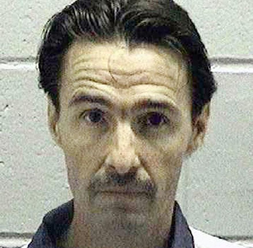 FILE - This undated file photo released by the Georgia Department of Corrections, shows Georgia inmate J.W. Ledford Jr. Ledford used his final moments to quote from the movie "Cool Hand Luke" and toss out an insult. It was one of the more unusual statements made by a Georgia death row inmate in the final moments. Strapped to a gurney that's tilted toward the witness seats, condemned inmates are given two minutes to make a last statement.(Georgia Department of Corrections via AP, File)