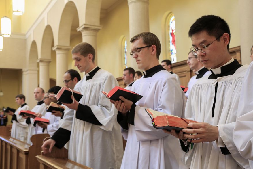 In this May 12, 2017 photo, members of the Priestly Fraternity of Saint Peter, a Catholic order formed in 1988, perform a Gregorian chant at Our Lady of Guadaloup seminary in Denton, Neb. The seminarians released an album, "Requiem," on May 12, singing a traditional Latin funeral Mass. (AP Photo/Nati Harnik)