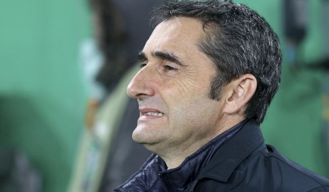 FILE - In this Dec. 8, 2016 file photo, Athletic Bilbao&#x27;s head manager Ernesto Valverde waits for the start of a Europa League group F soccer match against Rapid Vienna in Vienna, Austria. Athletic Bilbao said on Wednesday May 24 that Valverde will not remain as the team&#x27;s coach next season, clearing the way for his expected move to Barcelona. (AP Photo/Ronald Zak, File)