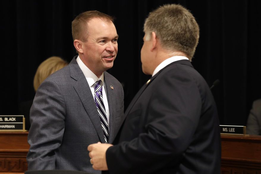 House Budget Committee member Rep. Drew Ferguson, R-Ga., right, greets Budget Director Mick Mulvaney on Capitol Hill in Washington, Wednesday, May 24, 2017, prior to Mulvaney testifying before the committee's hearing on President Donald Trump's fiscal 2018 federal budget. (AP Photo/Jacquelyn Martin)