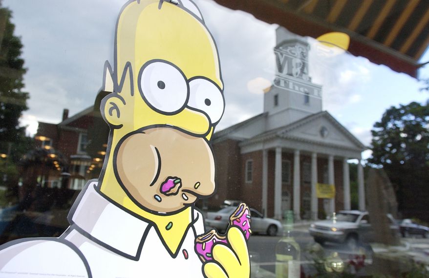 A poster of character Homer Simpson is displayed in the window of the 56 Main Street restaurant, Friday, July 20, 2007 along Main Street of Springfield, Vermont the day before the premiere of "The Simpsons Movie,' in the town's 100-seat movie theater. Springfield, Vermont beat out 13 other like-named cities for the right to host the premiere. The movie opens July 27. (AP Photo/Lisa Poole)