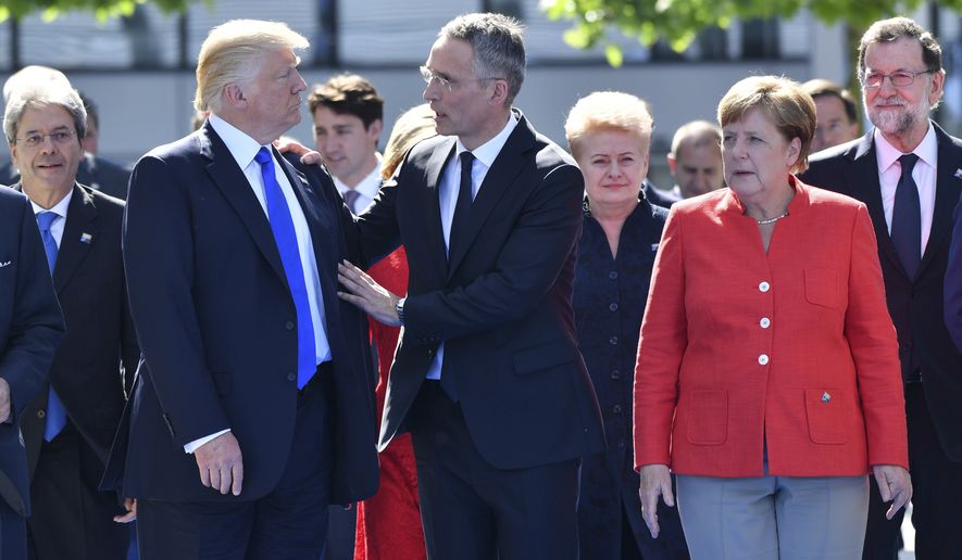 German Chancellor Angela Merkel, after hosting former President Barack Obama in Berlin, met with President Trump and NATO Secretary General Jens Stoltenberg on Thursday. (Associated Press)
