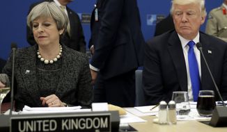 U.S. President Donald Trump, right, sits next to British Prime Minister Theresa May during in a working dinner meeting at the NATO headquarters during a NATO summit of heads of state and government in Brussels on Thursday, May 25, 2017. US President Donald Trump inaugurated the new headquarters during a ceremony on Thursday with other heads of state and government. (AP Photo/Matt Dunham, Pool)