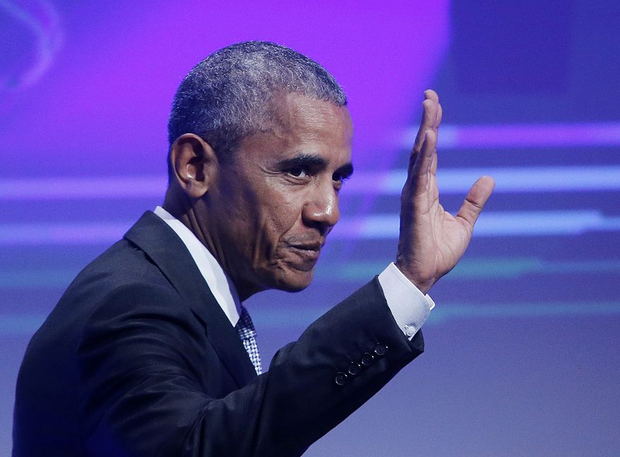 Former U.S. President Barack Obama waves before he is awarded the German Media Prize 2016 in Baden-Baden, Germany, Thursday, May 25, 2017. (AP Photo/Michael Probst)