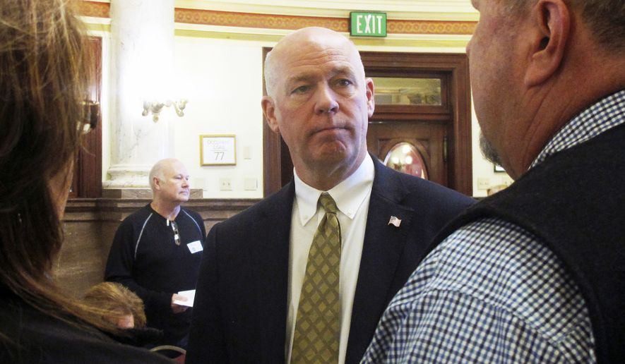 In this March 6, 2017, file photo, technology entrepreneur Greg Gianforte speaks to Republican delegates before a candidate forum in Helena, Mont. Gianforte, charged with misdemeanor assault for shoving a reporter to the ground on the eve of a special election, kept a low profile Thursday, May 25, even as supporters prepared a hotel ballroom for a possible victory party. (AP Photo/Matt Volz, File)