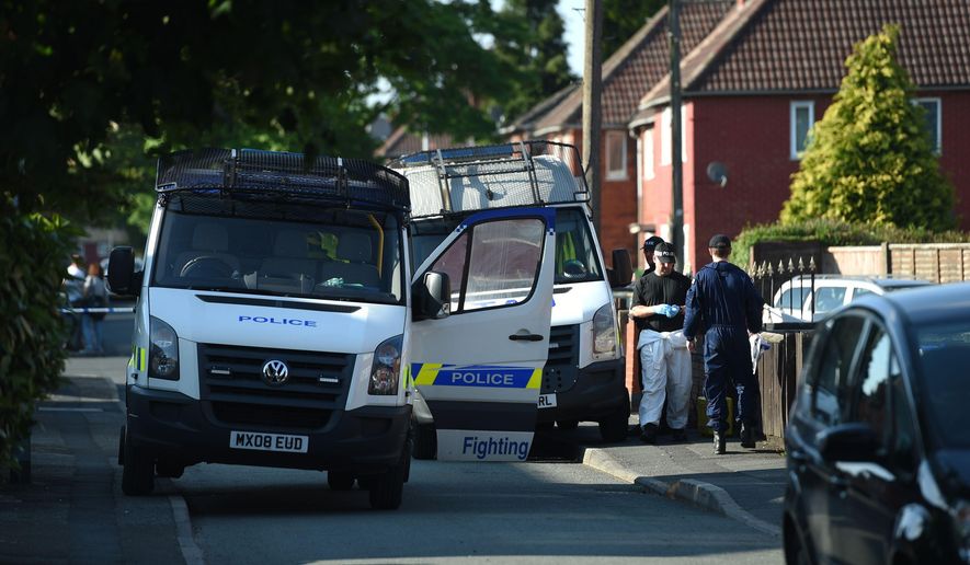 Police activity at an address in Elsmore Road, in connection with the concert blast at the Manchester Arena, in Manchester, England, Wednesday May 24, 2017. ﻿﻿British police say officers investigating the Manchester Arena concert blast have arrested a fifth suspect, and are assessing a package the suspect was carrying. Greater Manchester Police said the suspect was detained in Wigan, a town to the west of Manchester.  ( Joe Giddens/PA via AP)
