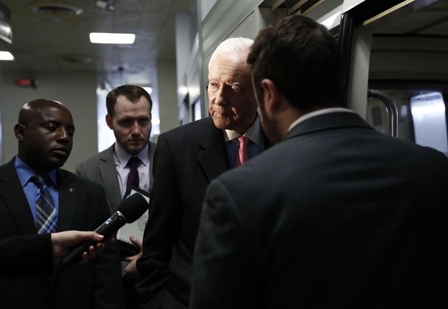 Sen. Orrin Hatch, R-Utah talk to a reporter as he steps onto the Capitol Subway on Capitol Hill in Washington, Wednesday, May 24, 2017. (AP Photo/Carolyn Kaster)