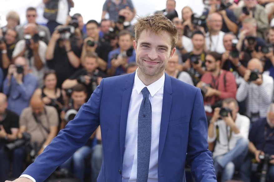 Actor Robert Pattinson poses for photographers during the photo call for the film Good Time at the 70th international film festival, Cannes, southern France, Thursday, May 25, 2017. (AP Photo/Alastair Grant)