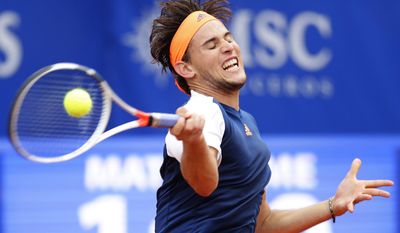 FILE - In this April 30, 2017, file photo, Dominic Thiem returns the ball to Rafael Nadal during their singles final match at the Barcelona Open Tennis Tournament in Barcelona, Spain. Heading into the French Open, the men at Nos. 1-5 in the ATP rankings are all 30 or older for the first time in history. While No. 1 Andy Murray, No. 2 Novak Djokovic, No. 3 Stan Wawrinka and No. 4 Rafael Nadal (No. 5 Roger Federer is skipping Paris) all have designs on another major trophy, could someone such as Alexander Zverev, who just turned 20 last month, or Dominic Thiem, 23, make a breakthrough for the kids? (AP Photo/Manu Fernandez, FIle)