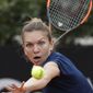 FILE - In this May 20, 2017, file photo, Simona Halep eyes the ball during her semifinal match against Kiki Bertens at the Italian Open tennis tournament, in Rome. Halep will be competing in the French Open. (AP Photo/Gregorio Borgia, File)